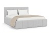Gepolstertes Doppelbett in Weiß mit Kissen und beiger Decke auf weißem Grund.