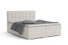 Boxspringbett in Ecru mit Cord-Bezug, gepolstertem Kopfteil und grauer Bettwäsche.