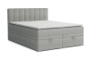 Graues Boxspringbett mit zwei praktischen Bettkästen und vertikal gestepptem Kopfteil.