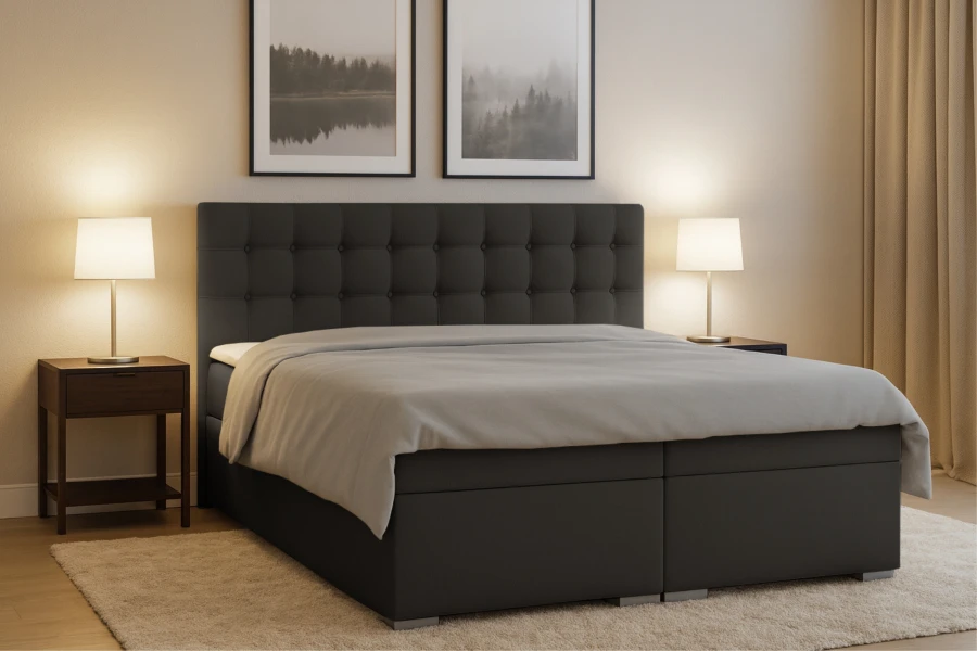 Dunkelgraues Boxspringbett Claudia mit hohem Kopfteil und Stauraum, ideal für modernen Schlafkomfort.