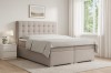 Beiges Boxspringbett Claudia mit gestepptem Kopfteil im hellen Schlafzimmer.