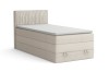 Beiges Boxspringbett mit Stauraum und geriffeltem Kopfteil freigestellt auf Weiß.