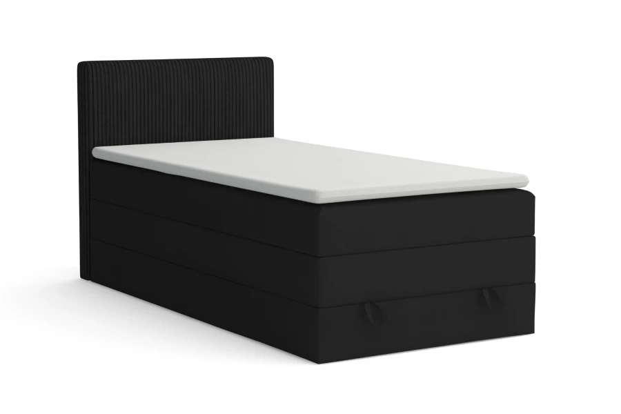 Schwarzes Boxspringbett mit strukturiertem Kopfteil und praktischem Bettkasten vor weißem Hintergrund.