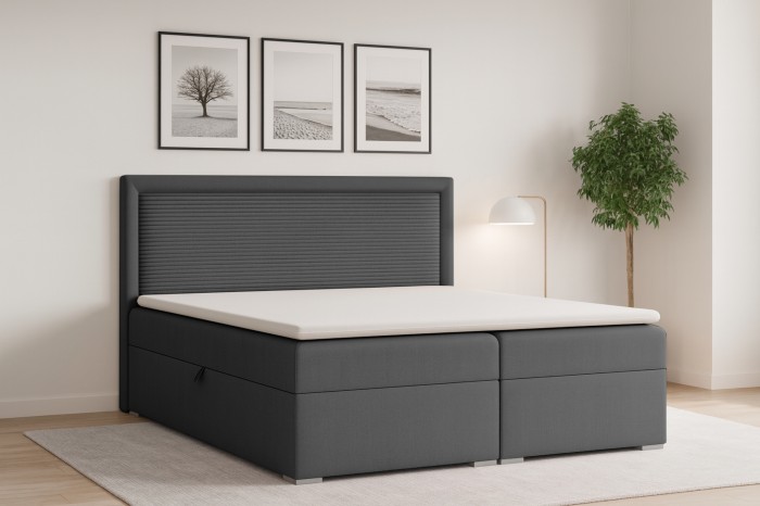 Antracietkleurig boxspringbed John II in een modern ingerichte slaapkamer.