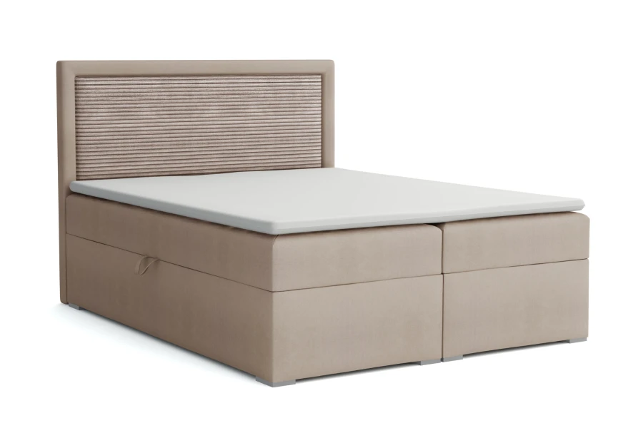 Beigefarbenes Boxspringbett mit strukturiertem Kopfteil-Einsatz auf weißem Hintergrund.