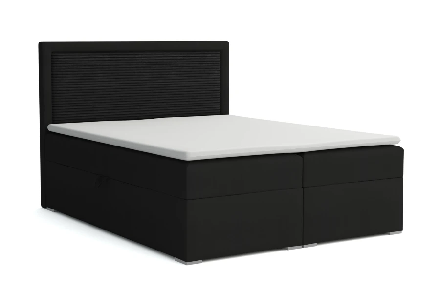 Schwarzes Boxspringbett mit Bettkasten und Kopfteil in Cord-Optik vor weißem Hintergrund.