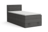 Graues Boxspringbett mit weißem Topper und Kopfteil, freigestellt auf Weiß.