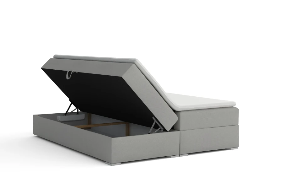 Boxspringbett mit aufgeklapptem Bettkasten für Stauraum