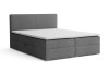 Graues Boxspringbett mit weißem Topper isoliert auf weißem Hintergrund.