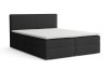 Dunkelgraues Boxspringbett mit weißem Topper und gepolstertem Kopfteil vor weißem Hintergrund.