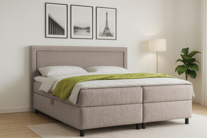 Modernes Schlafzimmer mit Boxspringbett John in Beige, Zimmerpflanze und Wandbildern.