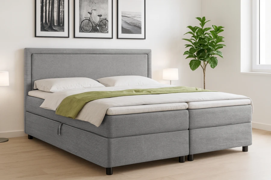 Modern eingerichtetes Schlafzimmer mit dem grauen Boxspringbett Lars als Mittelpunkt.