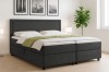 Anthrazitfarbenes Boxspringbett mit Cord-Bezug und Bettkasten.