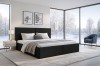 Schwarzes Polsterbett im luxuriösen Schlafzimmer mit Winterblick durch große Fenster