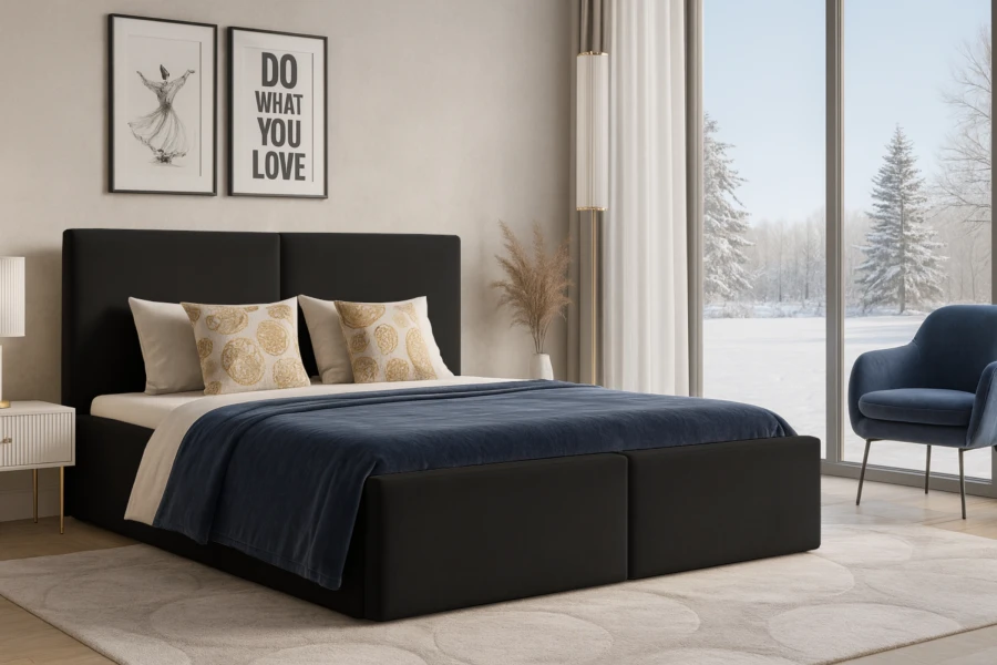 Schwarzes Polsterbett im modern eingerichteten Schlafzimmer mit Blick auf Winterlandschaft.