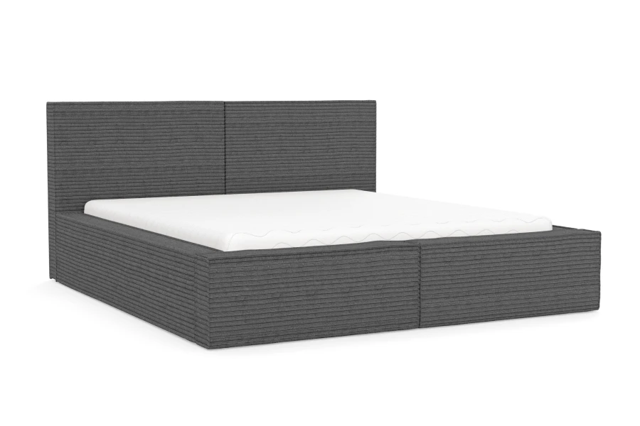 Elegantes Polsterbett in Grau mit Cord-Optik und weißer Matratze freigestellt.