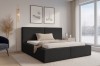 Stilvolles Schlafzimmer mit schwarzem Bett im Cord-Stil und Winterblick.