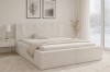 Modernes Schlafzimmer mit beigem Polsterbett und stilvoller Dekoration.