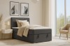 Antracietkleurig boxspringbed in modern ingerichte slaapkamer met hoofdbord.