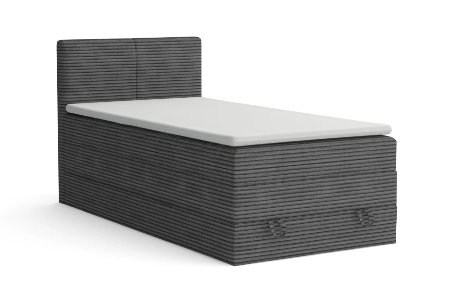Graues Boxspring-Einzelbett mit Cordbezug auf weißem Hintergrund.