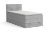 Light grey single box spring bed with corduroy cover and white topper on a white background