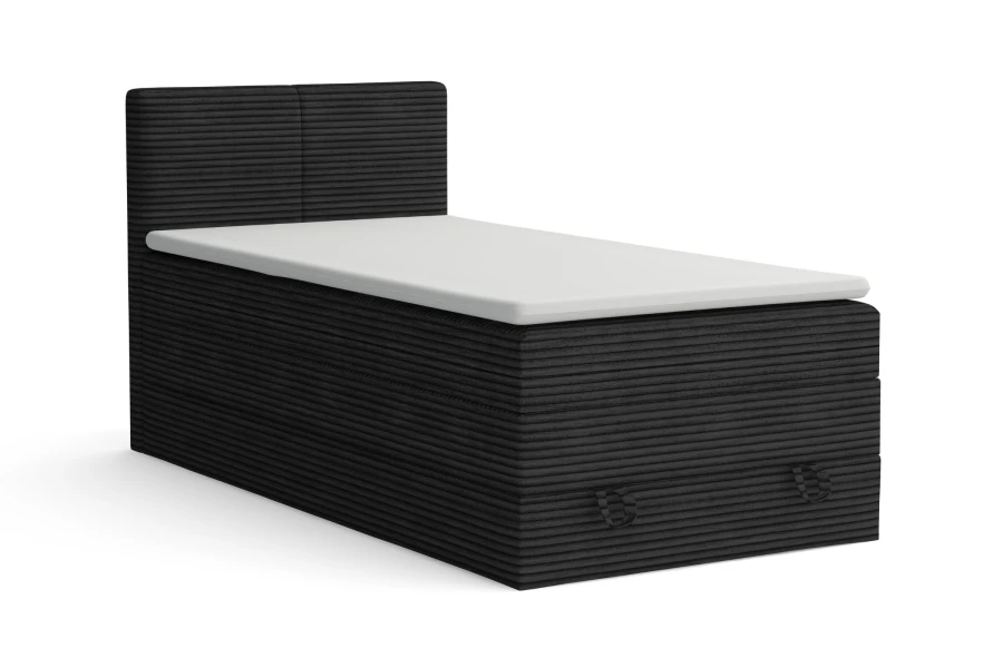 Modernes Einzelbett mit schwarzem Cord-Bezug und weißer Matratze