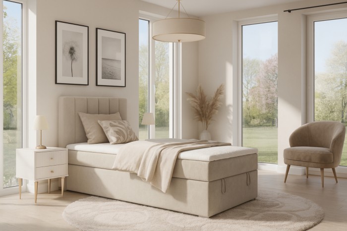 Cosy bedroom atmosphere with the beige David Mini box spring bed in a light design.