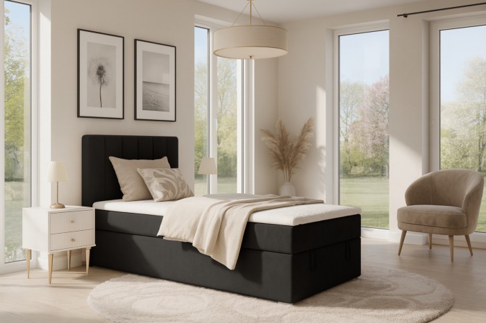 Zwart boxspringbed David Mini in een moderne slaapkamerambiance met veel daglicht.