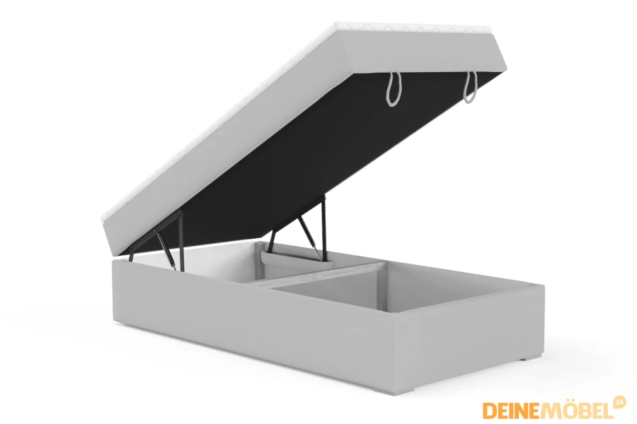 Hellgraues Boxspringbett mit aufgeklapptem Bettkasten für Stauraum.