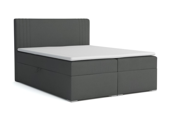 Modern donkergrijs boxspringbed met witte topper op een witte achtergrond