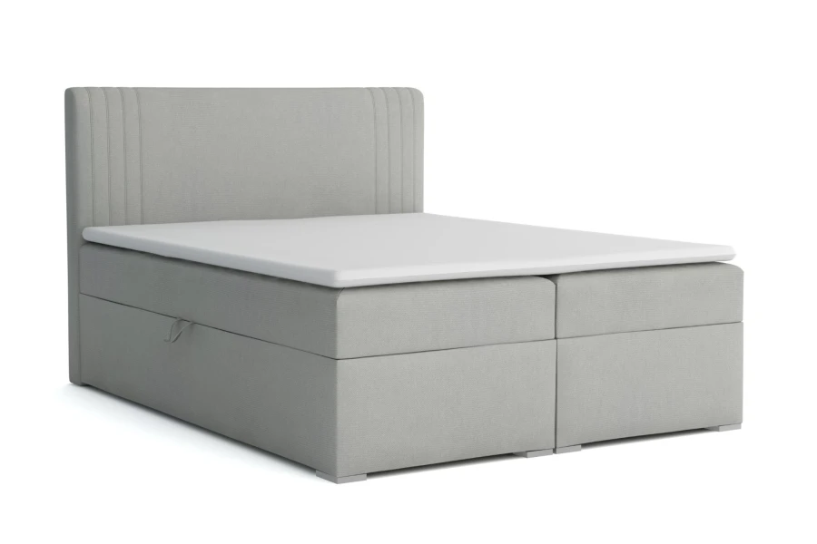 Elegantes graues Boxspringbett mit Stauraum-Bettkasten und abgestepptem Kopfteil.