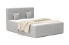 Modern gestoffeerd bed in lichtgrijze corduroy-look met hoofdbord en kussens.