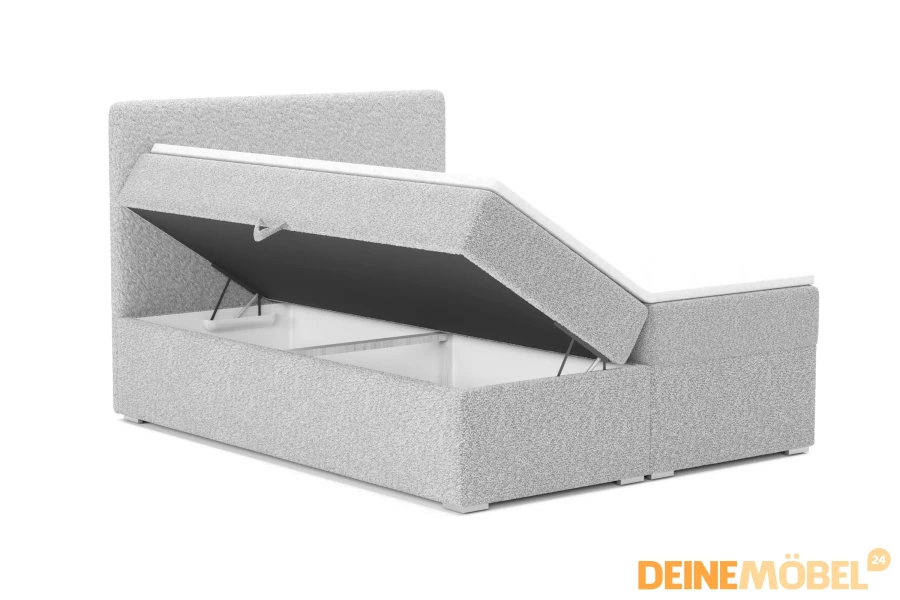 Boxspringbett in Hellgrau mit offenem Bettkasten für zusätzlichen Stauraum.