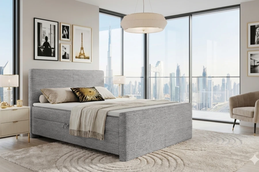 Luxuriöses Schlafzimmer mit grauem Cord-Boxspringbett und beeindruckendem Stadtblick.