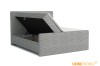 Graues Boxspringbett aus Cord mit geöffnetem Bettkasten für Stauraum.