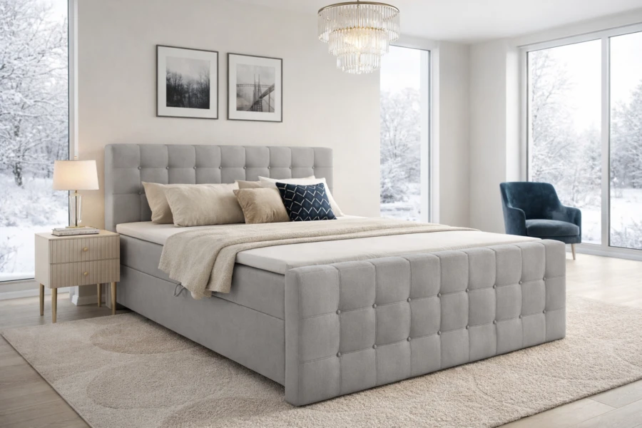 Modernes Boxspringbett in Grau in einem hellen Schlafzimmer mit elegantem Design.