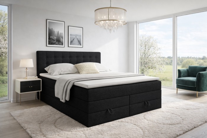 Zwart boxspringbed Verno in een moderne slaapkamerambiance met groot raam en tapijt.