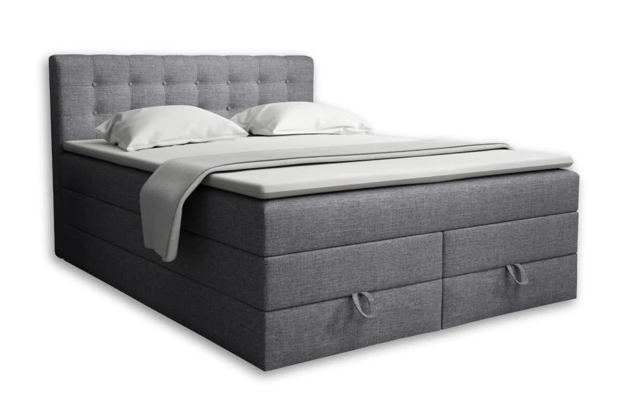 Hellgraues Boxspringbett mit Stauraum und gepolstertem Kopfteil, freigestellt.