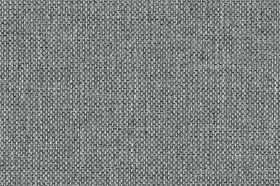 Detailaufnahme der grauen Textur des Boxspringbett-Bezugstoffs.