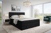 Schwarzes Boxspringbett mit Stauraum in einem stilvollen Schlafzimmer-Ambiente.