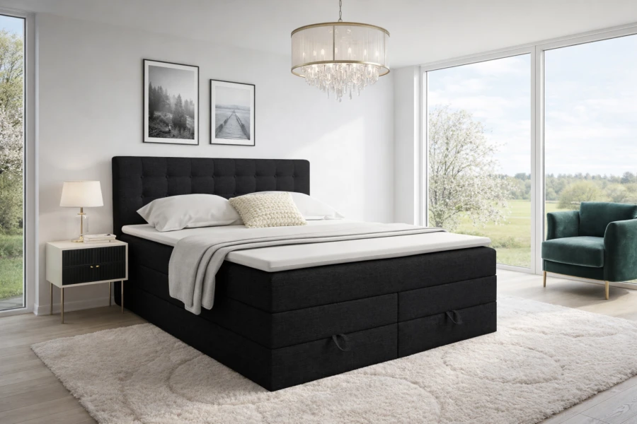 Schwarzes Boxspringbett mit Stauraum in einem stilvollen Schlafzimmer-Ambiente.