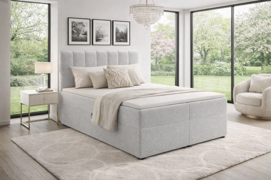 Hellgraues Vincent Boxspringbett mit gestepptem Kopfteil und modernem Design für das Schlafzimmer.