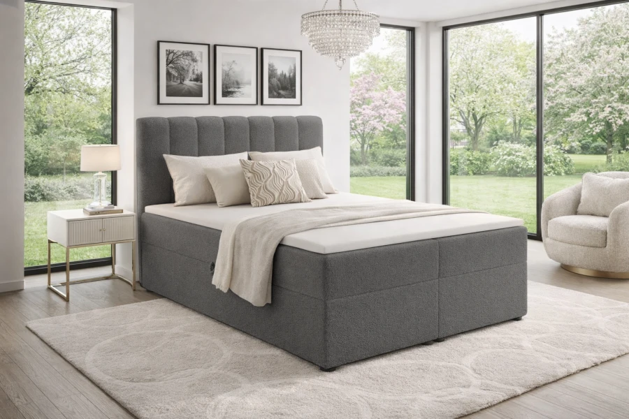 Dunkelgraues Vincent Boxspringbett mit komfortabler Polsterung und stilvollem Kopfteil.