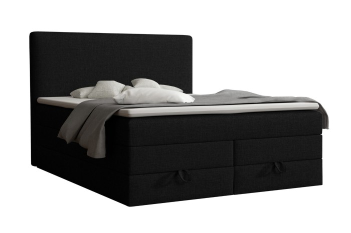 Black boxspring bed with practical storage box and high headboard.