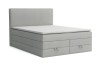 Hellgraues Boxspringbett mit Schubladen freigestellt auf weißem Grund.