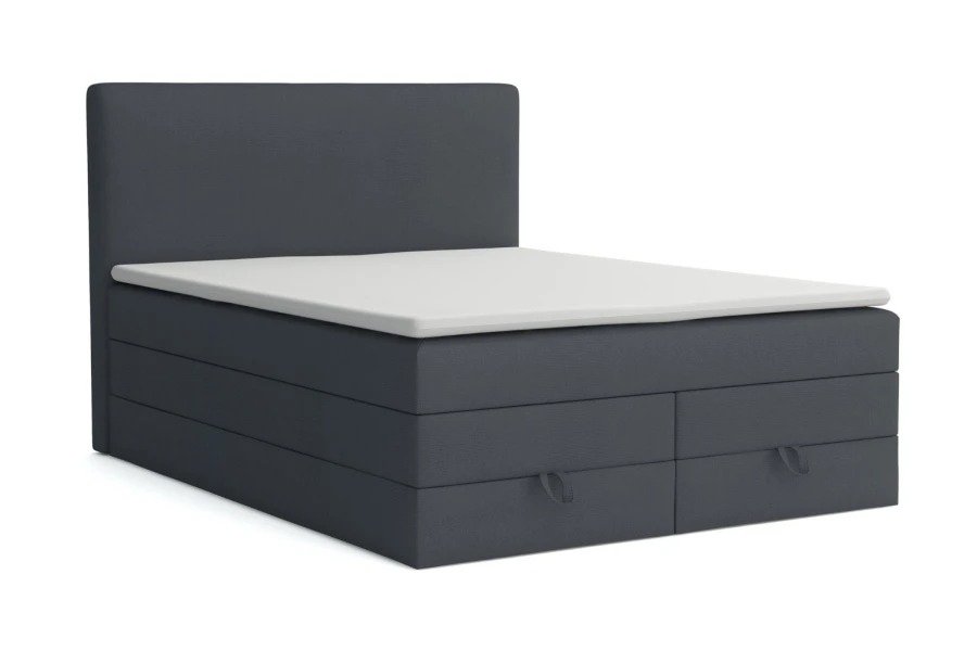 Dunkelgraues Boxspringbett mit praktischen Schubladen für Stauraum.
