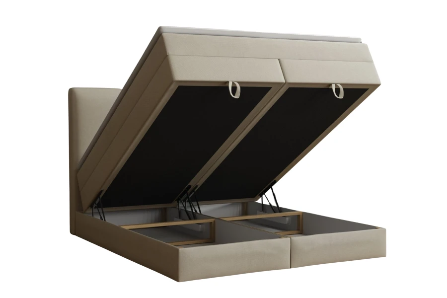 Geöffnetes Boxspringbett in Beige mit viel Stauraum im integrierten Bettkasten.
