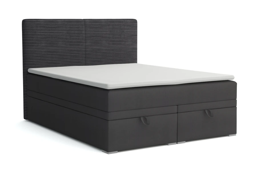 Anthracite box spring bed with ribbed headboard and integrated storage.