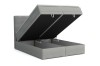 Grijs boxspringbed met geopende opbergruimte voor extra opslag.