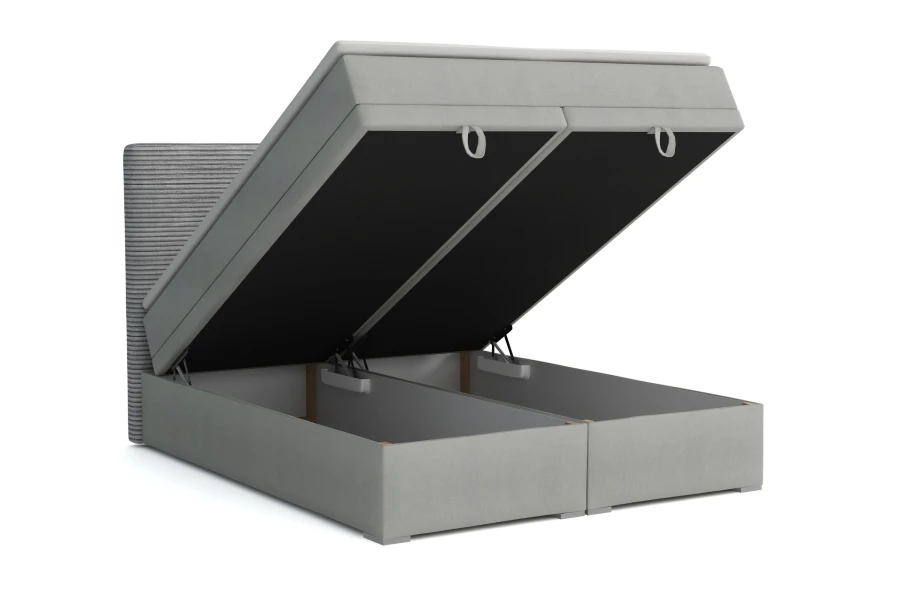 Grijs boxspringbed met twee opengeklapte bedbakken voor praktische opbergruimte in de slaapkamer.